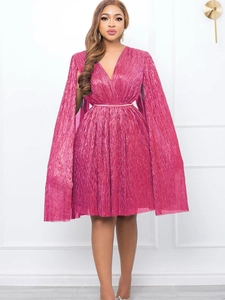 Elegant bright pink metallic pleated V-neck dress with cape sleeves and gold belt