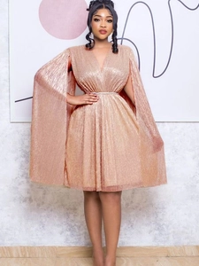 Elegant V-neck pleated champagne gold sequin dress with cape sleeves and waist belt