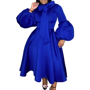 Detailed view of the royal blue evening dress with an oversized bow and lantern sleeves