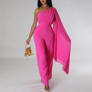 Detail of the elegant hot pink one-shoulder jumpsuit with flowing cape sleeve design