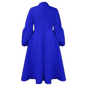 Back view of royal blue long sleeve dress featuring puffy sleeves and an invisible zipper