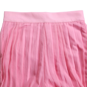 Detail of pink pleated wide leg pants waist with fine stitching and soft fabric texture