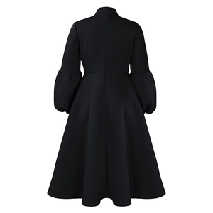 Detailed back view of a black lantern sleeve A-line dress with hidden zipper and high waist