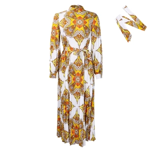 Detail of floral long sleeve pleated dress with orange mandala print and matching belt