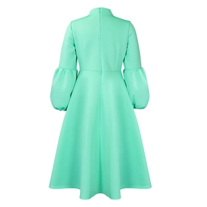 Back view of mint green puff sleeve dress with a high collar and hidden zipper