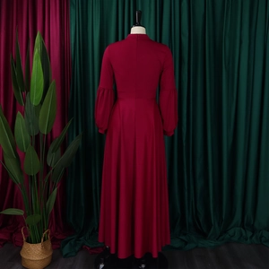 Rear view of a red high-waist maxi dress with lantern sleeves and back zipper closure
