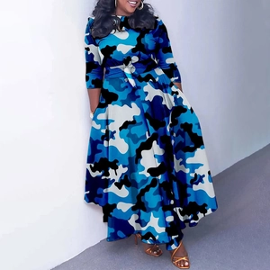 Detail of the elegant blue camouflage pattern on a long sleeve dress with bow belt
