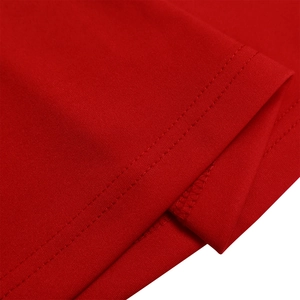 Detail showing double-needle stitching on the red polyester blend fabric of the dress