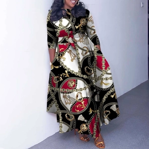 Detail of elegant baroque print dress featuring gold chain motifs and tied waist
