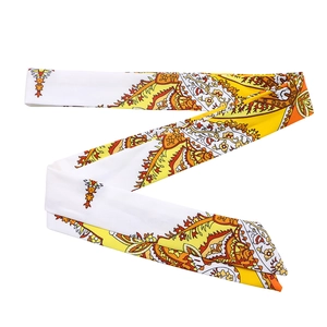 Close-up of bohemian paisley floral print satin narrow scarf with vibrant orange and yellow colors