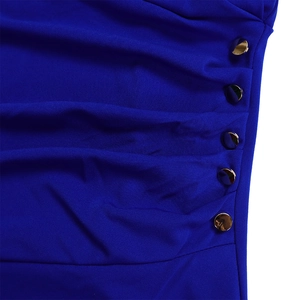 Detail of ruched navy blue fabric with five decorative gold buttons on the dress side