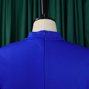 Detail of royal blue dress featuring an invisible back zipper and high stand collar