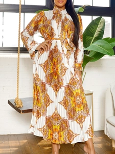 Long sleeve pleated paisley maxi dress with vibrant orange print and waist tie