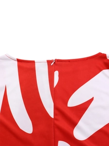 Close-up of invisible back zipper and round neckline on red printed floral dress