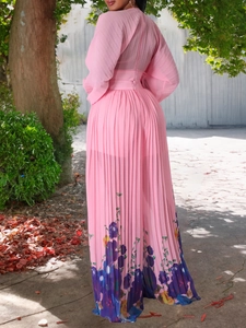 Elegant pink pleated chiffon jumpsuit featuring vibrant floral prints on wide-leg trousers