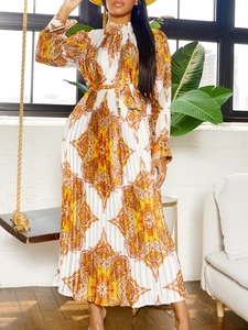 Elegant long sleeve pleated maxi dress with orange paisley print and waist tie belt