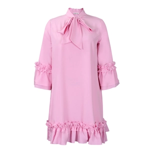 Detail of pussy-bow neckline and ruffled sleeves on a pink long sleeve A-line dress