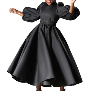 Detail of elegant black puff sleeve midi dress with matching belt and satin texture