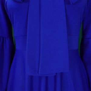 Detail of royal blue dress featuring a tied neckline and elegant high waist slimming design