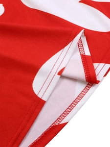 Macro view of detailed red and white print fabric with professional overlock stitching edge