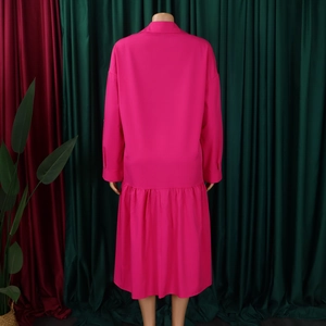 Rear view of rose pink long sleeve maxi dress with pleated hem and shirt collar design