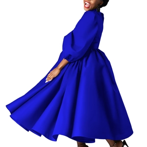 Detail view of royal blue puff sleeve dress with high waist and large flared skirt