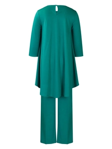 Detail view of the back showing a dark green two-piece set with a teardrop button closure