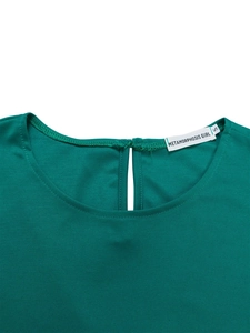 Detailed close-up of dark green round neckline with teardrop cutout and clean stitching