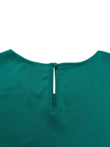 Detailed back view of dark green top featuring a round neck with keyhole and button closure
