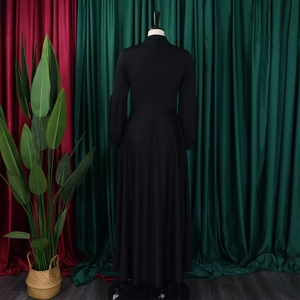 Rear view of long black dress featuring puff sleeves and an elegant high waist design