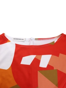 Detail of elegant round neckline with colorful geometric print and invisible back zipper