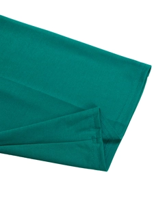 Detailed close-up of dark green knitted fabric texture and premium double-needle stitching