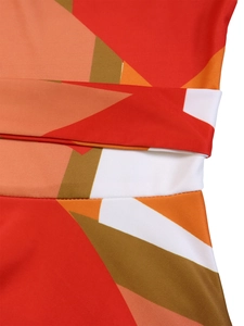 Detailed close-up of vibrant geometric print fabric with high-quality stitching