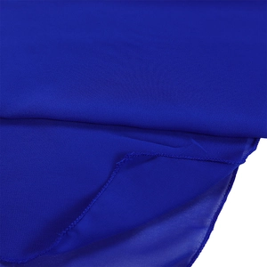Detailed close-up of premium royal blue chiffon fabric with refined hemmed edges