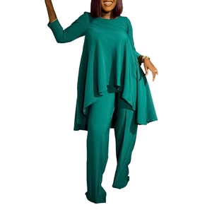Detail of dark green two-piece set featuring long top with irregular hem and wide-leg pants