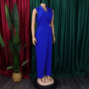 Detail of royal blue sleeveless jumpsuit with tuxedo collar and gold chain buckle accent