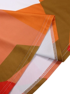 Detail of the high-quality overlock stitching and geometric print on the dress hem