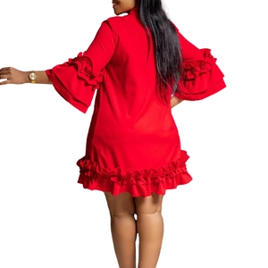 Detailed view of the layered ruffle sleeves and tiered hem on this red A-line mini dress