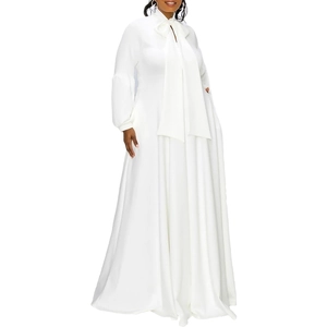 Detail of elegant white high-neck maxi dress with bow collar and lantern sleeves