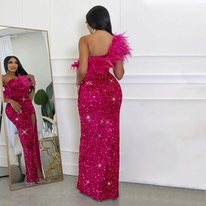 Detail of rose red sequin dress with feathered neckline and high slit design