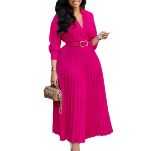 Detail of rose pink pleated maxi dress featuring a deep V-neck and matching buckled waist belt