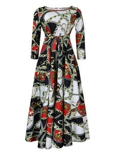 Detail of elegant chain and coin pattern print on a long sleeve vintage A-line dress