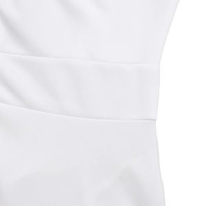 Close-up of high-waist pleated details on a white solid color long dress fabric