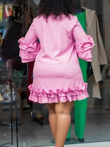 Pink A-line mini dress with layered ruffle flare sleeves and tiered hemline, back view