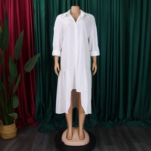 Detail of white long sleeve dress with high-low hem and ruffled shirt collar