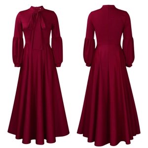 Detail of burgundy maxi dress featuring a bow tie neckline and elegant puff sleeves