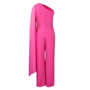 Detail view of fuchsia one-shoulder jumpsuit with flowing cape and invisible back zipper