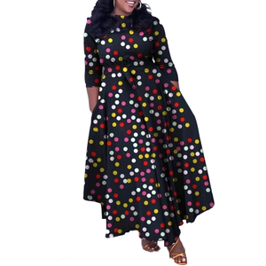 Detail view of long-sleeved black maxi dress with colorful polka dots and waist tie cord
