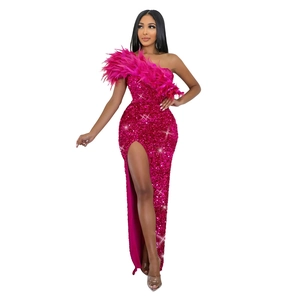 Detail of rose red sequin dress with shoulder feathers and high slit design