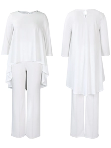 Detail of white two-piece set featuring asymmetrical high-low hem and wide-leg trousers